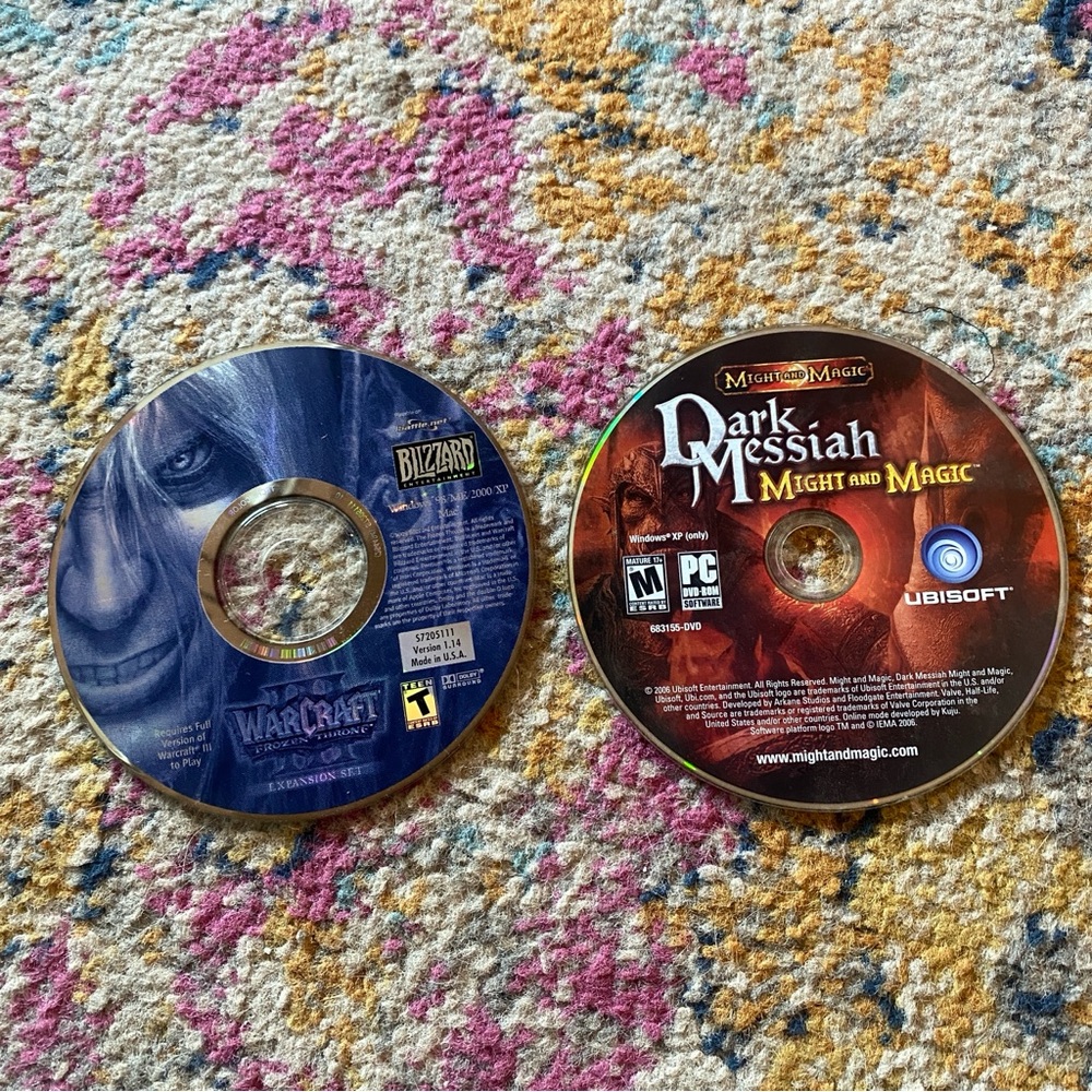 Blizzard Warcraft and Ubisoft Dark Messiah PC Game Discs